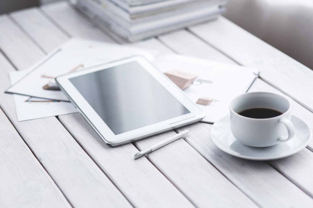 Tablet Computer and a Cup of Coffee